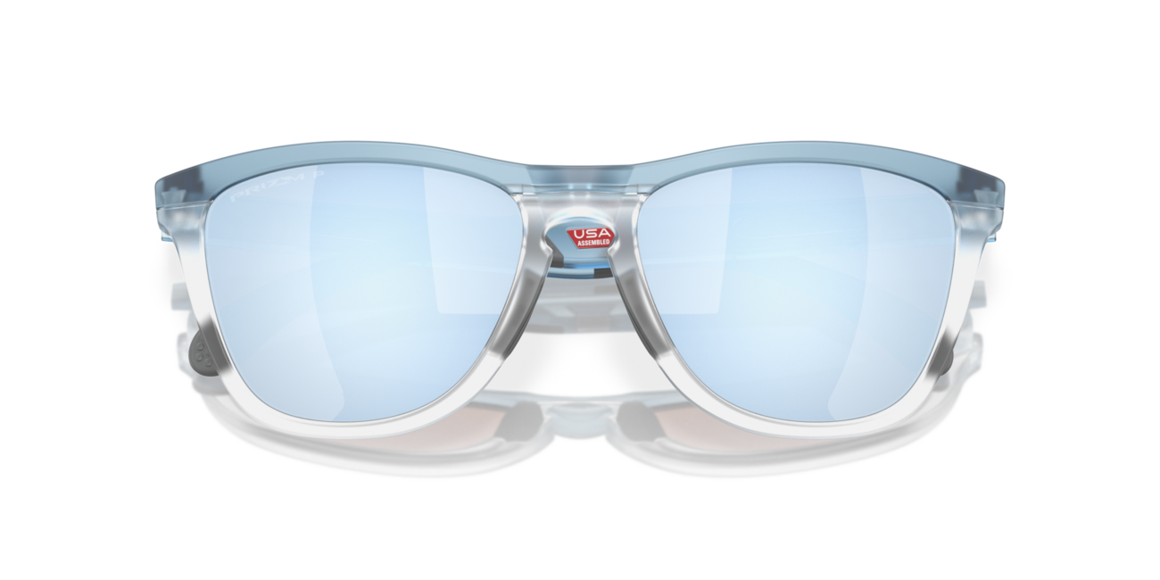 Oakley FROGSKINS RANGE mit Rahmen Trans Stonewash/Clear und mit Dias Prizm Deep Water Polarized 55