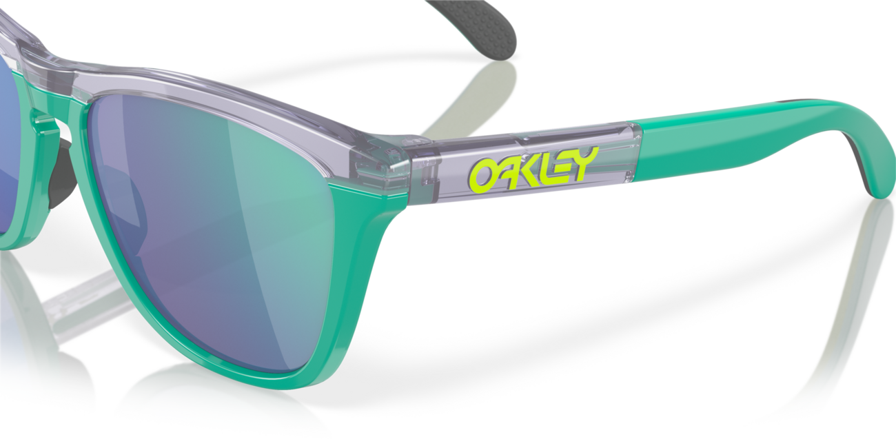 Oakley FROGSKINS RANGE Sonnenbrille mit Rahmen Trans Lilac/Celeste und mit Dias Prizm Jade 55