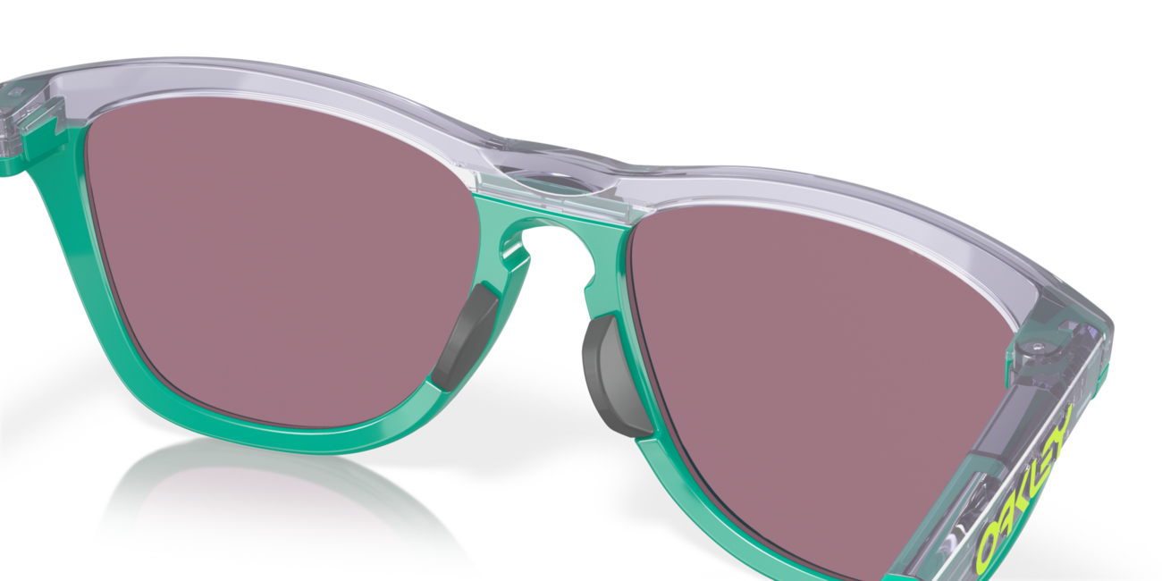 Oakley FROGSKINS RANGE Sonnenbrille mit Rahmen Trans Lilac/Celeste und mit Dias Prizm Jade 55