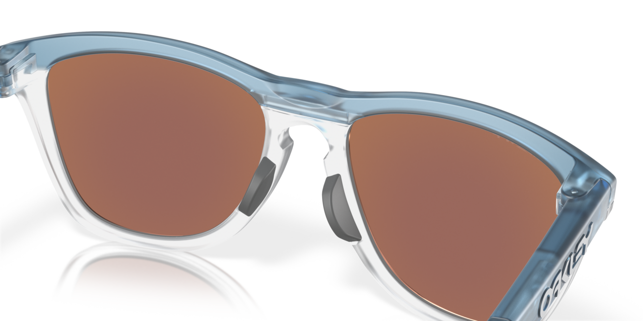 Oakley FROGSKINS RANGE mit Rahmen Trans Stonewash/Clear und mit Dias Prizm Deep Water Polarized 55